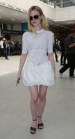 Elle-Fanning-in-White-Dress-at-Nice-Airport--04.jpg