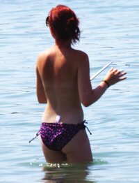 young_redhead_topless_at_the_beach_12.jpg